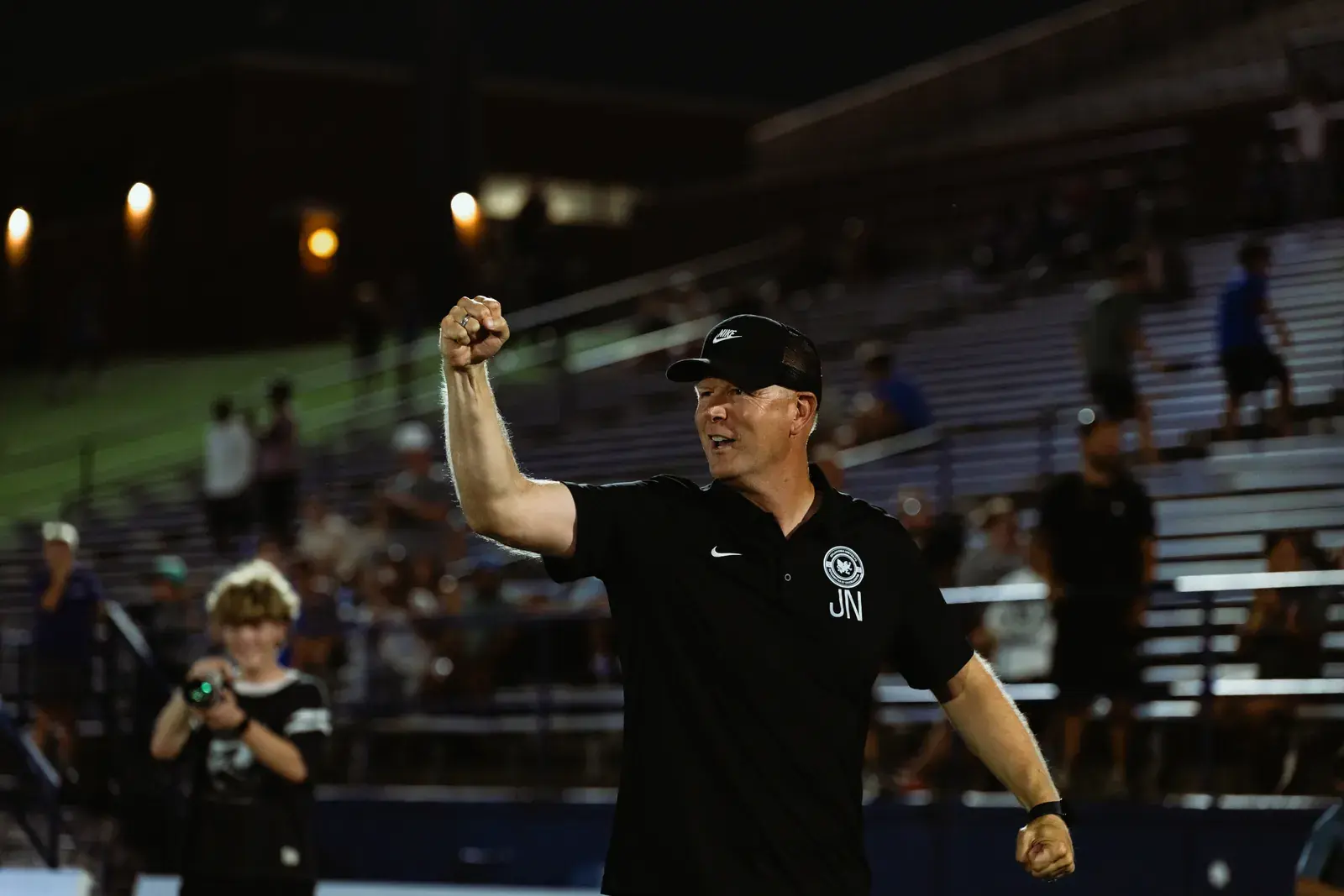 Oklahoma United head coach Jimmy Nielsen punching the air in celebration after the win over Tulsa Athletic